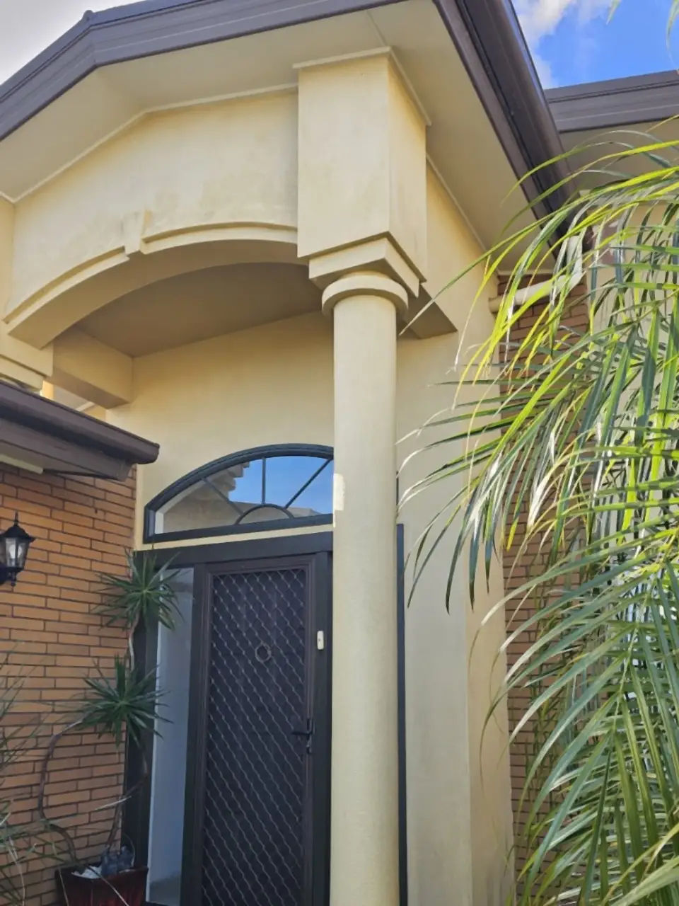 After: The same entrance and columns clean