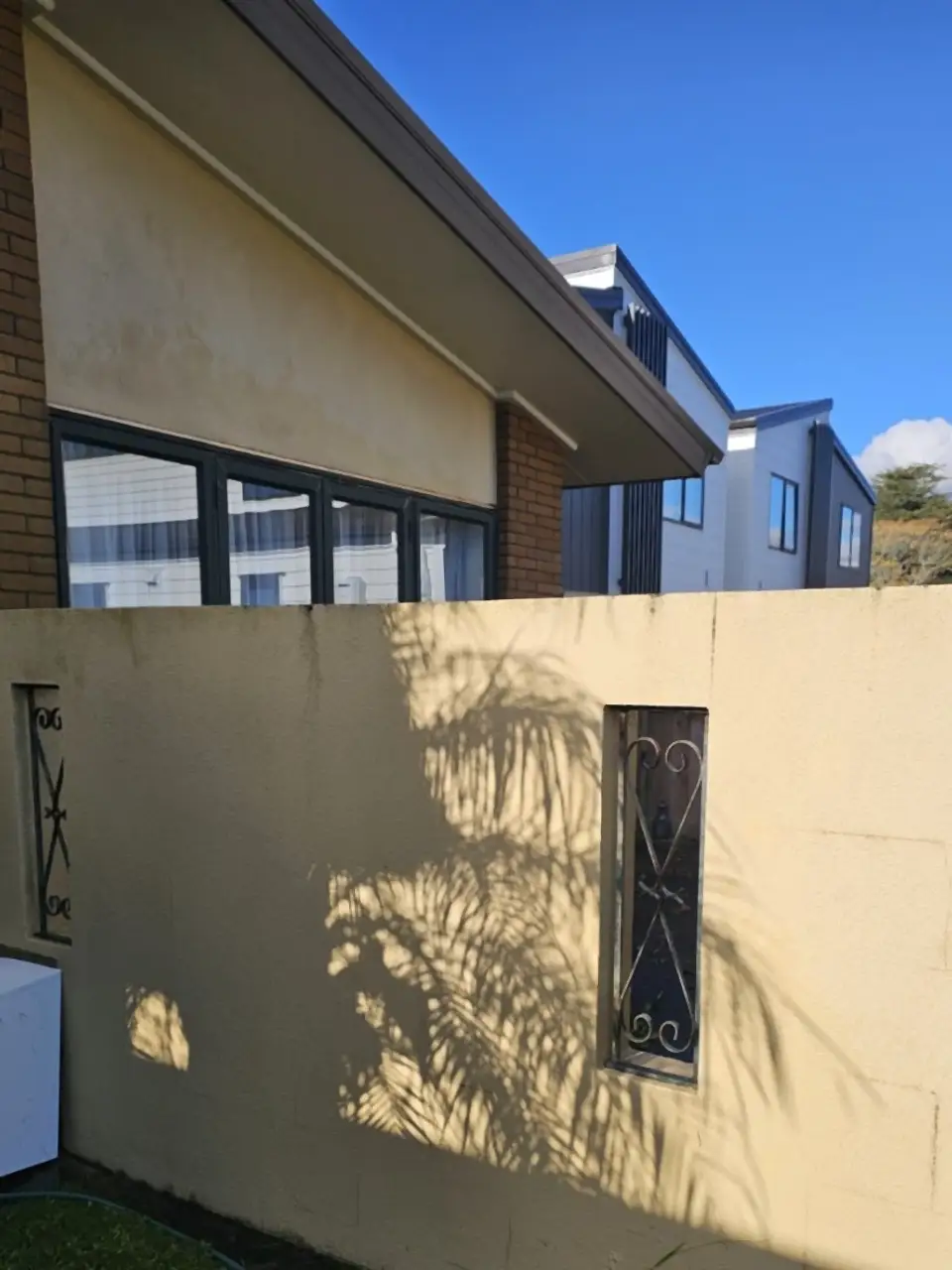 After: The same wall back to a warm cream